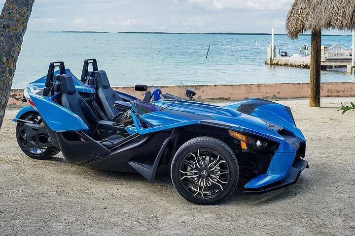 Experience the open air of Florida as you zip around in the Polaris Slingshot perfect for scenic drives and soaking up the sun while enjoying your favorite music.